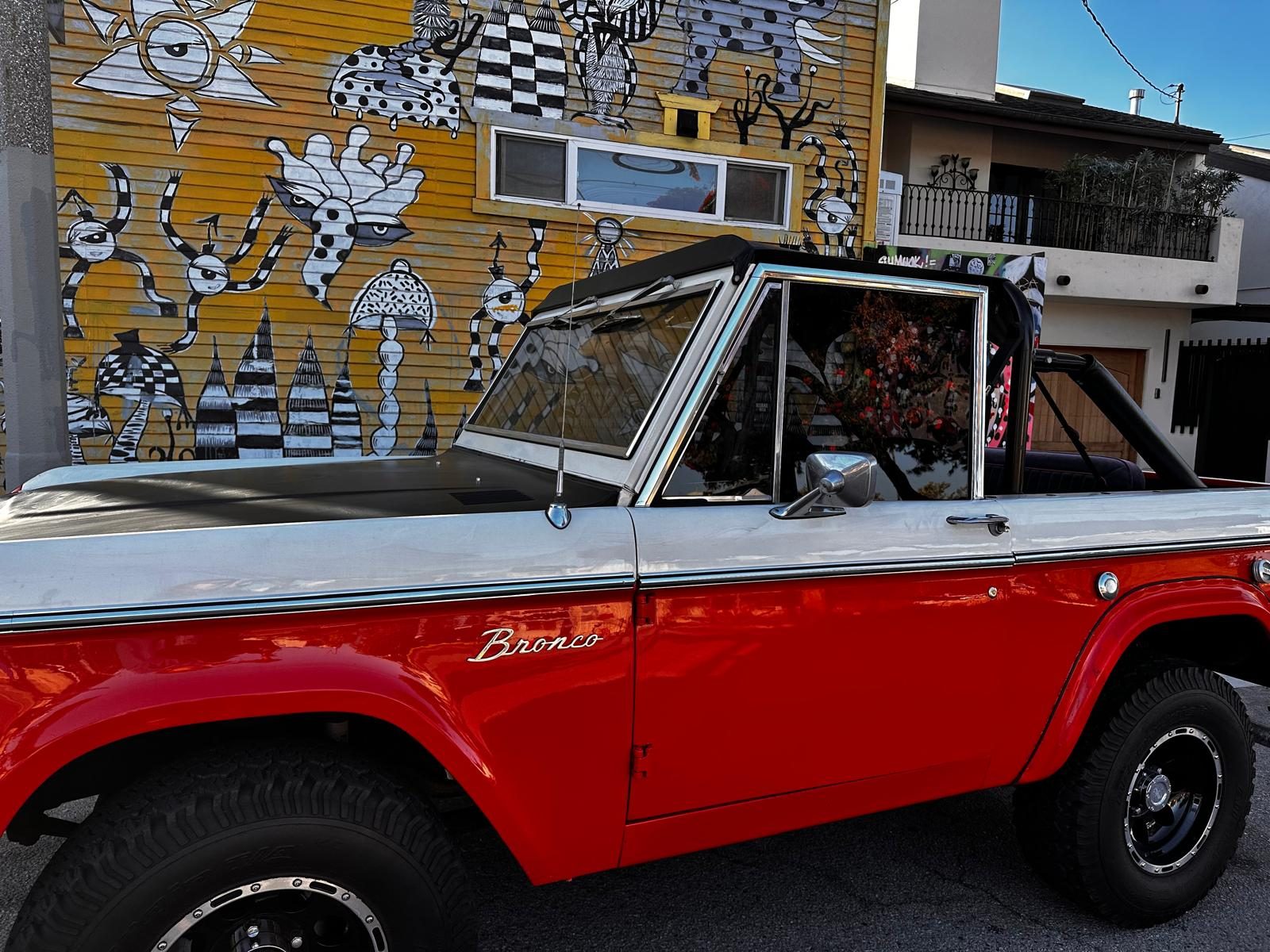 Bronco in front of a Venice mural